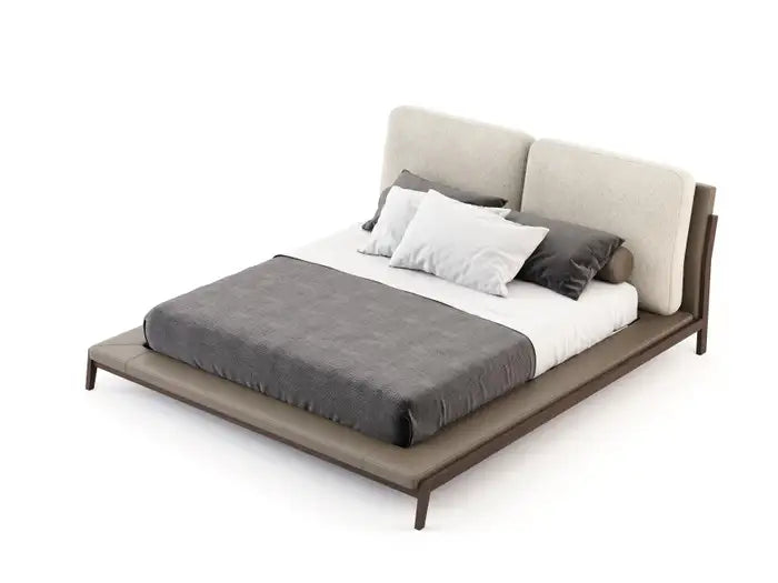 Modern bed with gray bedding and pillows on a white background