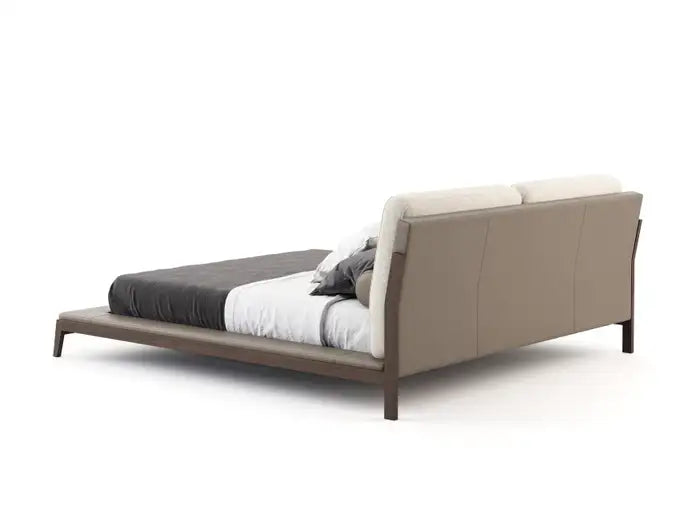 Beige bed with white bedding on a white background